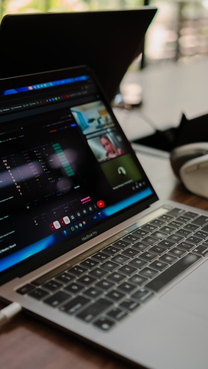 A laptop showing a video conference call, ideal for remote work concepts.